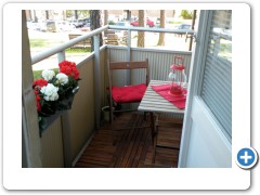 balcony with flowers and all